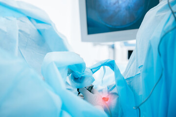 Surgical procedure in operating room with advanced medical equipment