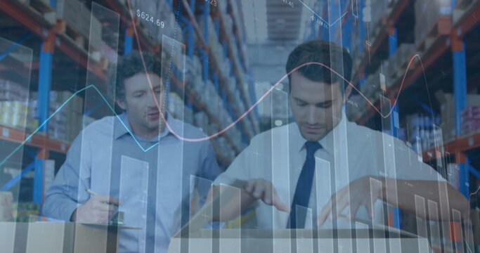 Image of financial graphs over caucasian male warehouse workers