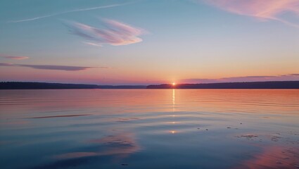 Fototapeta premium Serene sunset over calm water, painted in soft pinks and blues. The sun dips below the horizon, casting a warm glow on the tranquil scene.