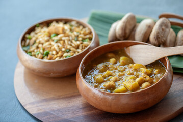 A bowl of rice with a spoon in it
