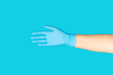 Medical nitrile gloves,blue cap, disposable medical mask on textured background. Medic protective clothing. Surgical latex gloves. Rubber gloves manufacturing.Medicine concept. Top view. Copy text
