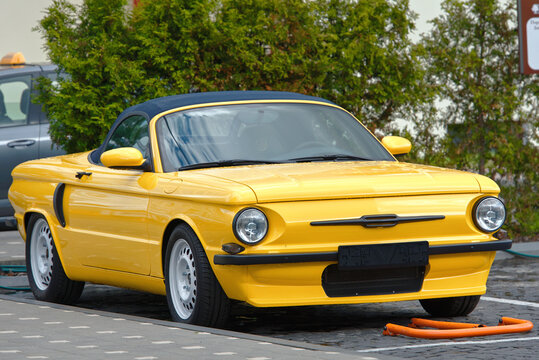 Minsk, Belarus. May 27, 2021. ZaPprsche  - unique yellow car built on the Porsche Boxter S (986) based on the design of the iconic Soviet car ZAZ-968 "Zaporozhets". Made by ShifCustom workshop