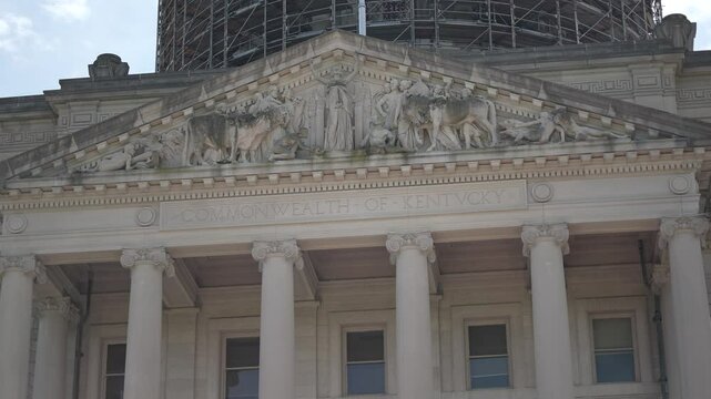 The Kentucky State Capitol in Frankfort is undergoing renovations, featuring scaffolding that highlights its historical architecture and legislative significance.