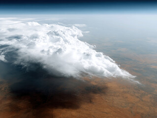 Fototapeta premium Aerial view of large cloud formation over dry landscape, with clear sky and atmospheric layers visible background