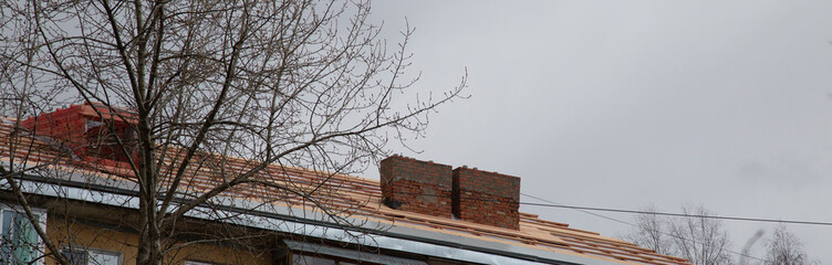 Repair of the roof of a large apartment building.