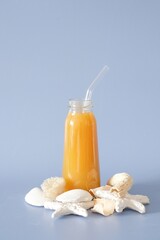 Enjoy a Refreshing Fruit Juice served with a Straw and Delicious Coconut Treats this summer