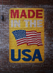Made In The USA painted on brick wall with US flag