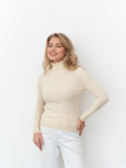 Elegant woman models fashion attire in a studio setting during a creative photoshoot