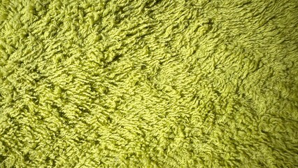  close-up of lime green shaggy textured fabric surface for backgrounds, web design, packaging, print media, branding, and textile pattern references