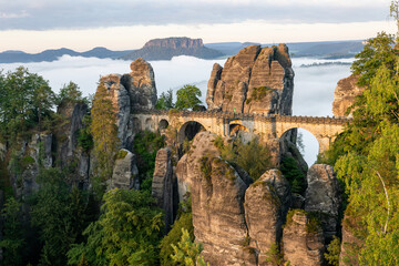 Majestic sunrise onto Bastei bridge in Saxon Switzerland revealing stunning natural rock formations