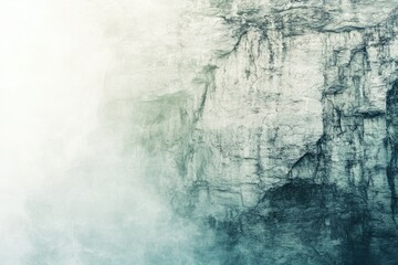 Obraz premium Misty, textured cliff face with a gradient of teal and white, evoking serenity and mystery.