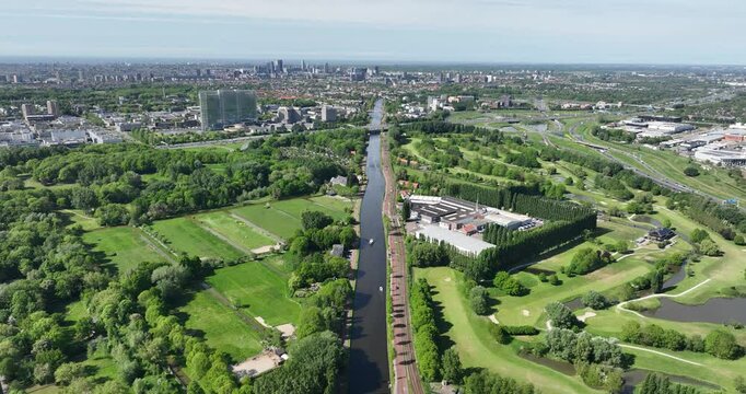 Rijn Schie canal, river waterway through Rijswijk, The Netherlands, aerial drone video. Skyline.