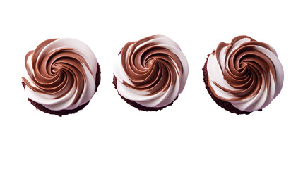 Three cupcakes with swirled chocolate and white frosting isolated on a white background