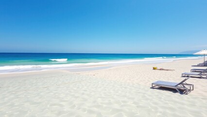 Peaceful Empty Beach with Clear Skies and Turquoise Waves Rolling In