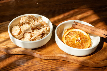 honey dripping from a white spoon and orange dried