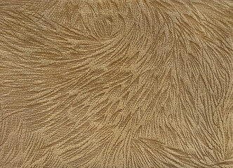 Close up of carpet rug flooring in golden brown color. Fabric with feather and fur in brown color. Seamless modern minimalist rug texture with tufted fur. Suitable for living room floor.