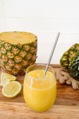 Homemade Pineapple Ginger Lemon Smoothie in a Glass. Refreshing Detox and Anti-Inflammatory Drink