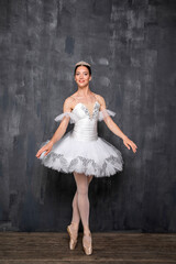 Naklejka premium Studio portrait of a ballerina in a white tutu