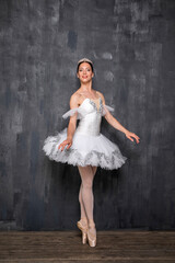 Fototapeta premium Studio portrait of a ballerina in a white tutu
