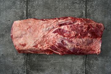 Raw Beef Meat Cut on Concrete Background