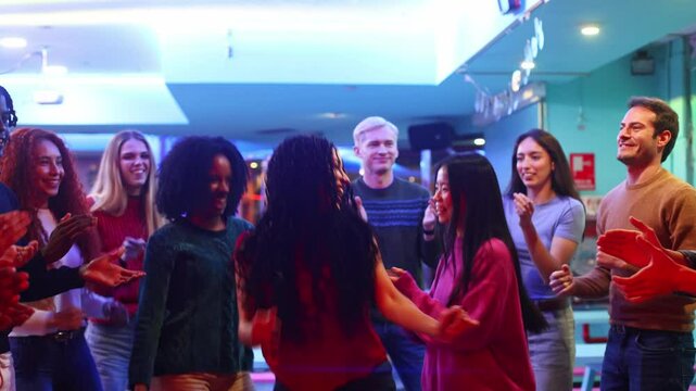 Friends dancing and celebrating together at roller disco