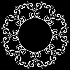 Round white frame on a black background framed with a beautiful pattern with flowers