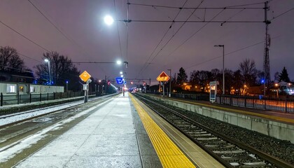 Train Station Platform at Night with Snow and Lights