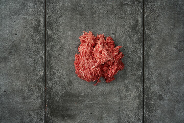 Raw Ground Beef on Dark Stone Surface