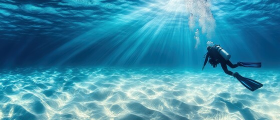 Scuba diver swims underwater, exploring depths with tranquility, illuminated by sunlight, enjoying underwater activity.