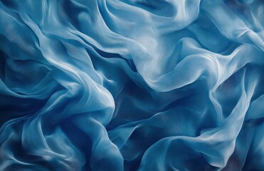Obraz premium Top view of flowing blue silk fabric with wavy texture, creating an abstract background ideal for fashion design and product decoration.