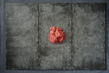 Raw Ground Meat on Dark Stone Background