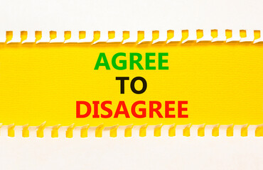 Agree to disagree symbol. Concept words Agree to disagree on beautiful yellow paper on clothespin....