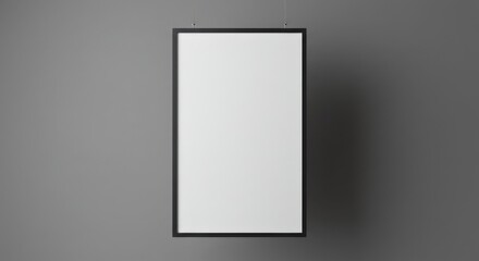 Minimalist blank picture frame on a gray wall  