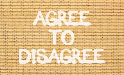 Agree to disagree symbol. Concept words Agree to disagree on beautiful brick wall . Beautiful brick...