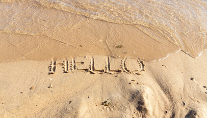 Business hello and welcome concept. Concept word Hello written on beautiful Red sea ocean sand beach. Beautiful Red sea ocean sand beach background, copy space. Business hello and welcome concept.