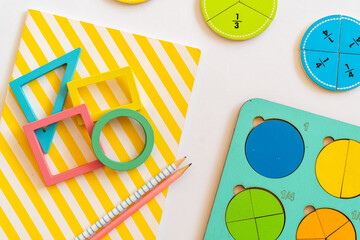 Colorful learning tools for teaching shapes and fractions on a bright background. education,  back...