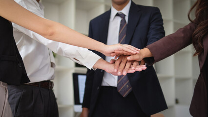 Fototapeta premium Business people join hands, have goals, success, work together as a team.