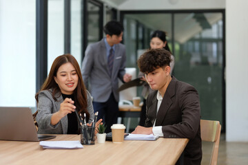 Businessmen and women checking documents before entering a meeting