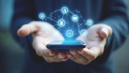 Close-up of a hand holding a smartphone with a digital interface, surrounded by holographic  and futuristic technology symbols