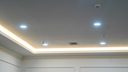 Modern interior design featuring recessed lighting and subtle architectural details