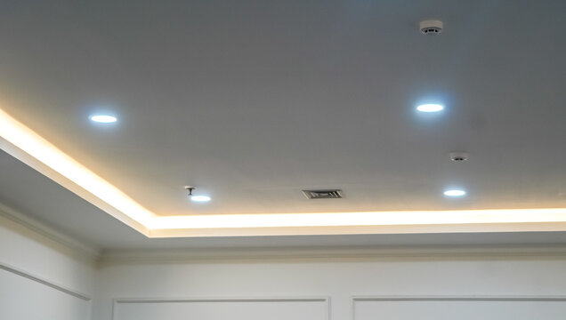 Modern interior design featuring recessed lighting and subtle architectural details