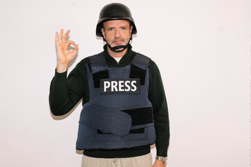 Journalist making OK hand gesture
