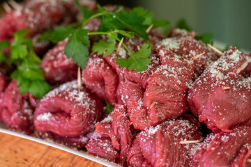 Horse meat Braciole or Brasciole, are a typical dish from the province of Bari in Puglia. Braciole are bundles of meat, stuffed with a mixture of parsley, garlic, and cheese in a butcher's for sale