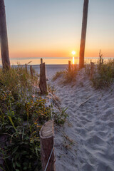 Sunset over the Baltic Sea at Darß Peninsula in Germany creates a serene coastal atmosphere