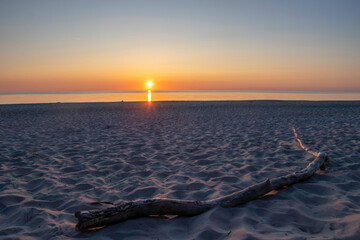 Sunset casting warm hues over the tranquil Baltic Sea at Darß Peninsula in Germany