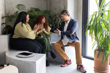 Business team discussing strategy in modern coworking space