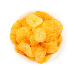 Tasty ridged chips in bowl isolated on white, top view