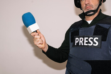 Male reporter pointing during broadcast