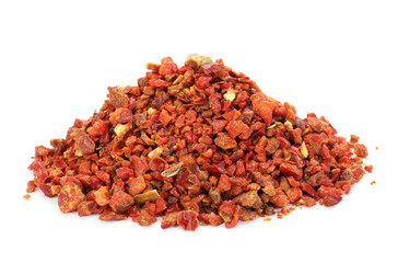 Pile of red chili pepper flakes isolated on white