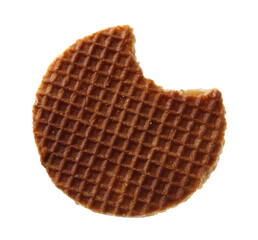 Bitten round Dutch waffle isolated on white